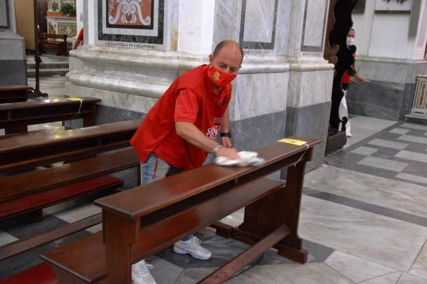 man in red shirt cleaning church professionally in baton rouge