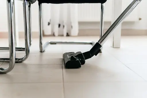 office cleaning christmas party vacuuming floor